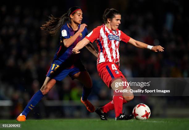 Andressa Alves of Barcelona competes for the ball with Andrea Pereira of Atletico de Madrid during the Liga Femenina match between FC Barcelona Women...