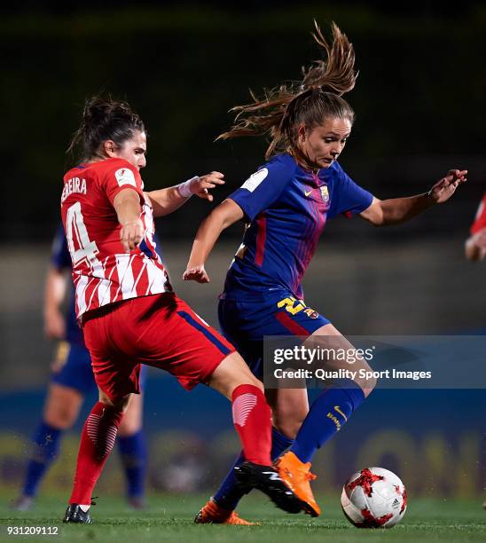 Lieke Martens of Barcelona is tackled by Andrea Pereira of Atletico de Madrid during the Liga Femenina match between FC Barcelona Women and Atletico...