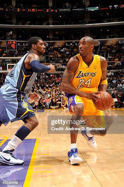 Kobe Bryant of the Los Angeles Lakers looks to maneuver against O.J. Mayo of the Memphis Grizzlies during the game on November 6, 2009 at Staples...