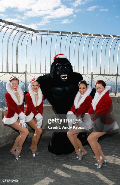 Radio City Rockettes Tara Dunleavy, Blair Chenoweth, Afra Hines and Jessica Osborne light The Empire State Building in celebration of the opening...