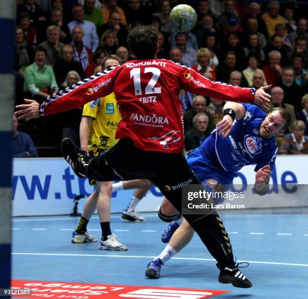 Vignir Svavasson of Lemgo scores a goal against goalkeeper Henning Fritz of Rhein Neckar during the Handball Bundesliga match between TBV Lemgo and...