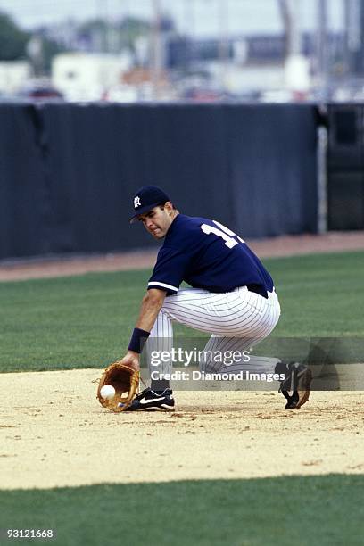 Thirdbaseman Mike Lowell of the New York Yankees backhands a ground ball during workouts prior to a Spring Training game in March, 1998 at the...