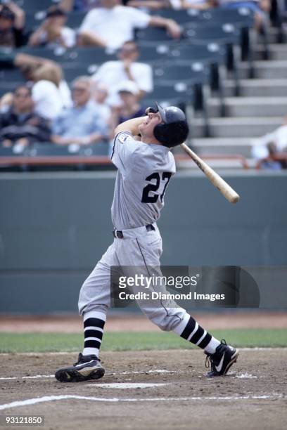 Outfielder Mark Kotsay of the Portland Sea Dogs, Class AA affiliate of the Florida Marlins, pops a pitch up during a game in May, 1997 against the...