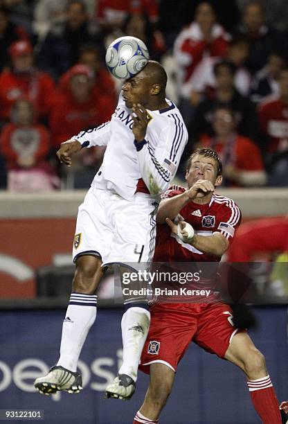 Jamison Olave of Real Salt Lake goes up for a header as Brian McBride of the Chicago Fire tries to get position during the second half of the MLS...