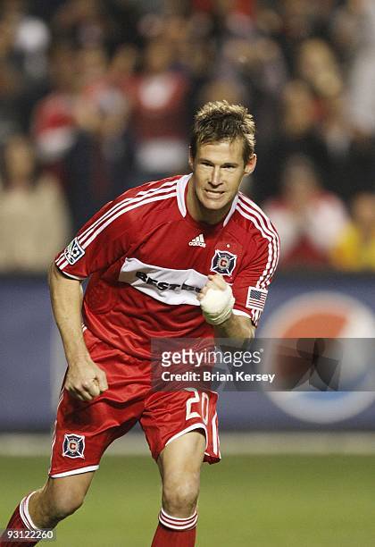 Brian McBride of the Chicago Fire pumps his fist after scoring during the shoot-out against Real Salt Lake during the MLS Eastern Conference...