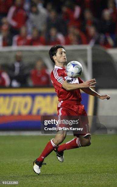 John Thorrington of the Chicago Fire handles the ball against Real Salt Lake during overtime of the MLS Eastern Conference Championship at Toyota...