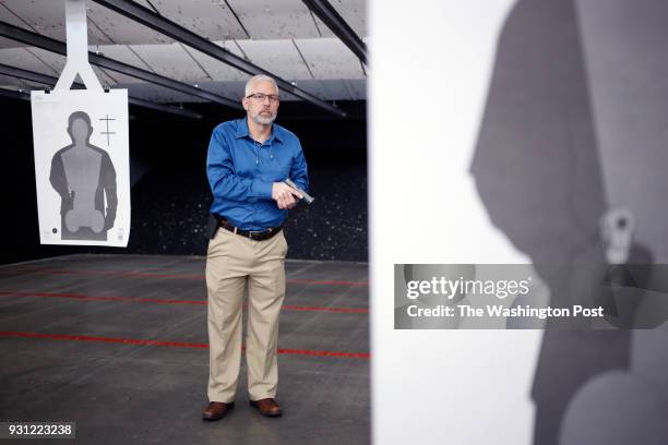 Firearms instructor Joe Eaton stands for a portrait at Premier Shooting & Training Center in West Chester Township, Ohio. On Tuesday, February 27,...