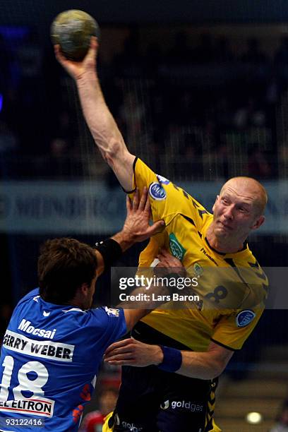 Tamas Mocsai of Lemgo challenges Karol Bielecki of Rhein Neckar during the Handball Bundesliga match between TBV Lemgo and Rhein Neckar Loewen at the...