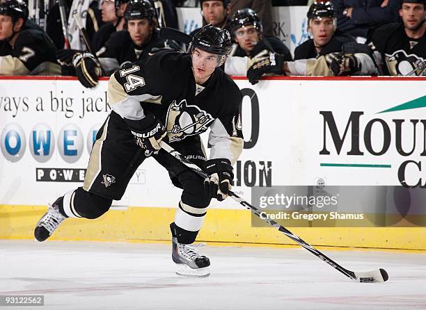 Chris Kunitz of the Pittsburgh Penguins moves the puck up ice against the New Jersey Devils on November 12, 2009 at Mellon Arena in Pittsburgh,...