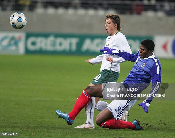 France's forward Anthony Modeste vies with Slovenia's midfielder Kevin Kampl during the Euro 2011 under 21 qualification football match France vs....
