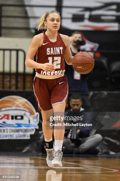 Alyssa Monaghan of the St. Joseph's Hawks dribbles up court during the Championship game of the Atlantic-10 Women's Basketball Tournament against the...