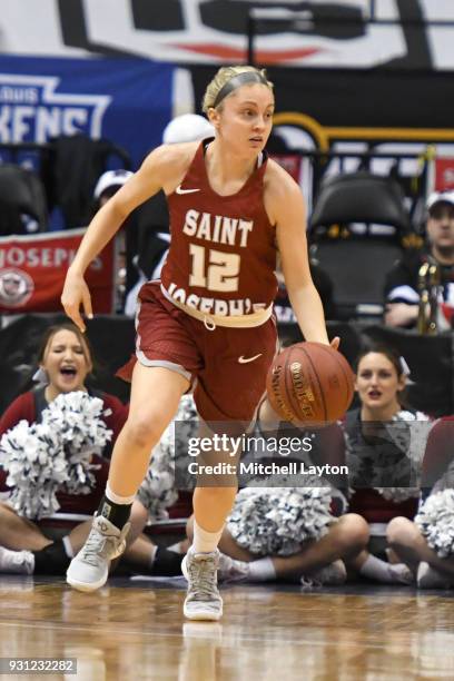 Alyssa Monaghan of the St. Joseph's Hawks dribbles up court during the Championship game of the Atlantic-10 Women's Basketball Tournament against the...