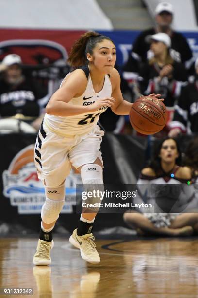 Mei-Lyn Bautista of the George Washington Colonials dribbles the ball up court during the Championship game of the Atlantic-10 Women's Basketball...