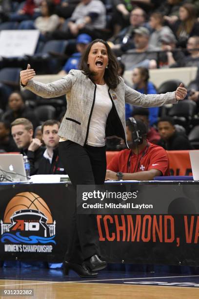 Head coach Jennifer Rizzotti of the George Washington Colonials reacts to a call during the Championship game of the Atlantic-10 Women's Basketball...