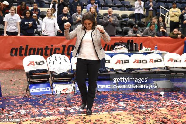 Head coach Jennifer Rizzotti of the George Washington Colonials celebrates winning the Championship game of the Atlantic-10 Women's Basketball...