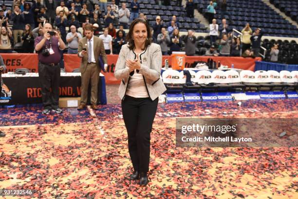 Head coach Jennifer Rizzotti of the George Washington Colonials celebrates winning the Championship game of the Atlantic-10 Women's Basketball...