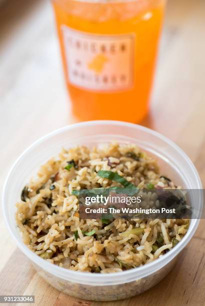 Arroz Chaufa - steamed basmati rice with soy sauce, rice vinegar, green onion, cilantro, bacon & sesame seeds at Chicken Whiskey in Washington, DC on...