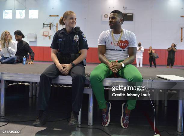 Jason Derulo and officer S. Rodriquez join choreographer Jeremy Strong after teaching youth choreography to Jason Derulo's new single "Colors" at...