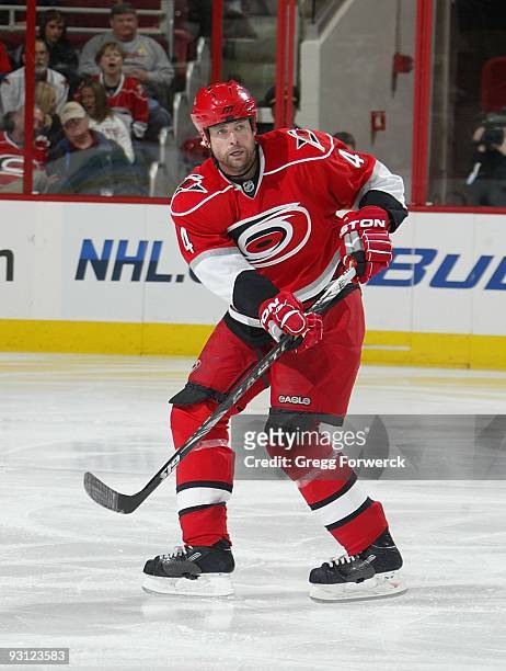 Aaron Ward of the Carolina Hurricanes passes the puck during a NHL game against the Los Angeles Kings on November 11, 2009 at RBC Center in Raleigh,...