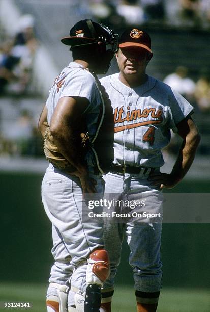 Manager Earl Weaver of the Baltimore Orioles standing on the mound with catcher Clay Dalrymple during a mid 1960's MLB baseball game. Weaver Managed...