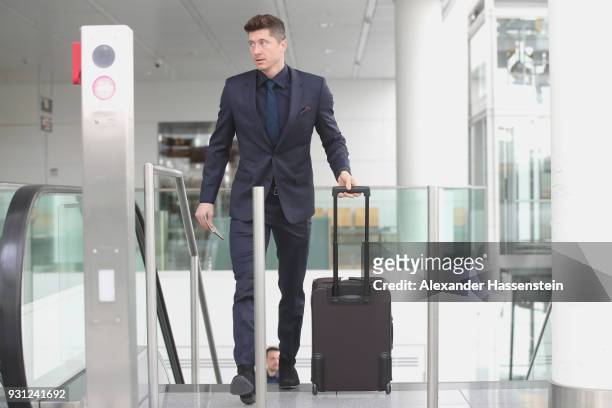 Robert Lewandowski of FC Bayern Muenchen arrives at Munich international airport 'Franz Josef Strauss' prior their team flight for the UEFA Champions...