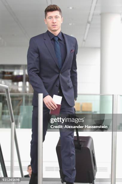 Robert Lewandowski of FC Bayern Muenchen arrives at Munich international airport 'Franz Josef Strauss' prior their team flight for the UEFA Champions...