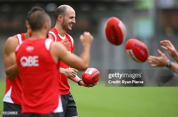 Tadhg Kennelly of the Swans handballs during a Sydney Swans AFL training session at Lakeside Oval on November 18, 2009 in Sydney, Australia. Kennelly...