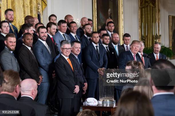 President Donald Trump welcomes the Houston Astros to the White House to celebrate their World Series Championship, in the East Room, on Monday,...