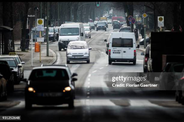 Cars drive on a city street on March 06, 2018 in Berlin, Germany.