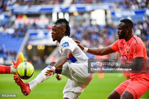 Bertrand Traore of Lyon and Ismael Diomande of Caen during the Ligue 1 match between Olympique Lyonnais and SM Caen at Parc Olympique on March 11,...