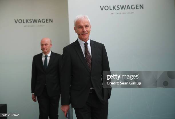 Matthias Mueller , Chairman of German automaker Volkswagen AG, and VW Chief Financial Officer Frank Witter arrive for the company's annual press...