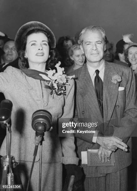 American actress Joan Bennett and her husband, film producer Walter Wanger leave New York on the 'SS Queen Elizabeth' to attend the Royal Command...