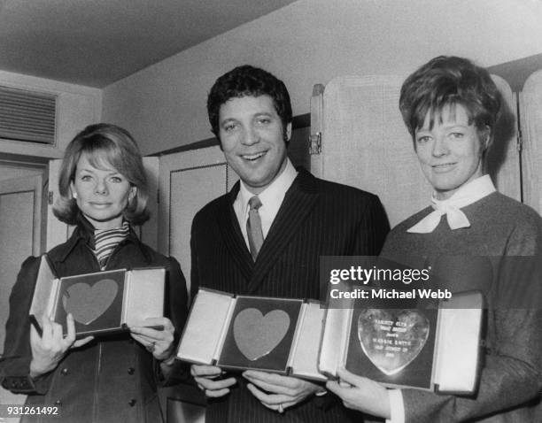 From left to right, actress Jill Bennett , singer Tom Jones and actress Maggie Smith with their awards at the Variety Club of Great Britain Show...