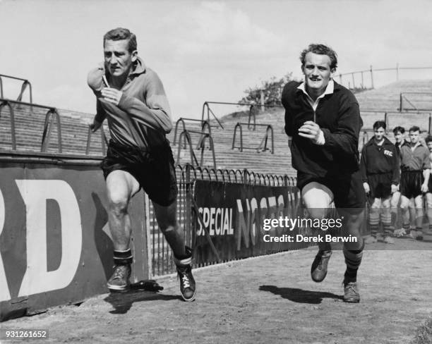 Fulham footballers Roy Bentley and Trevor 'Tosh' Chamberlain during sprint training at Craven Cottage in London, 21st August 1957. They are preparing...