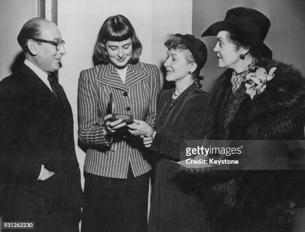 Swedish actress Ingrid Bergman receives the Drama League of New York's annual award for Distinguished Performance, for her work in the Maxwell...