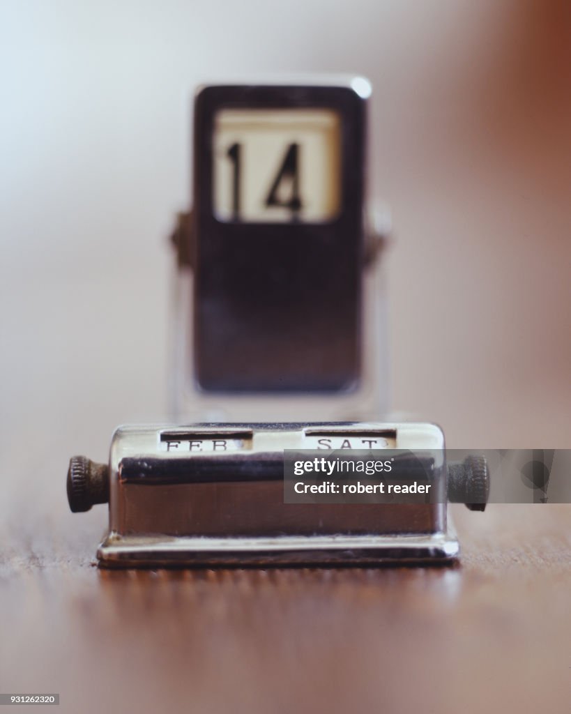 Chrome perpetual date calendar displaying February 14th Valentine’s Day