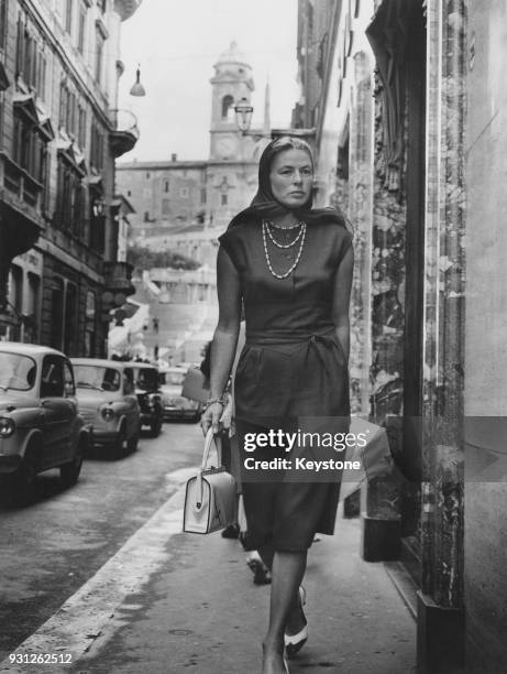 Swedish actress Ingrid Bergman out shopping in the Via Condotti in Rome, Italy, whilst filming 'The Visit', 5th September 1963.