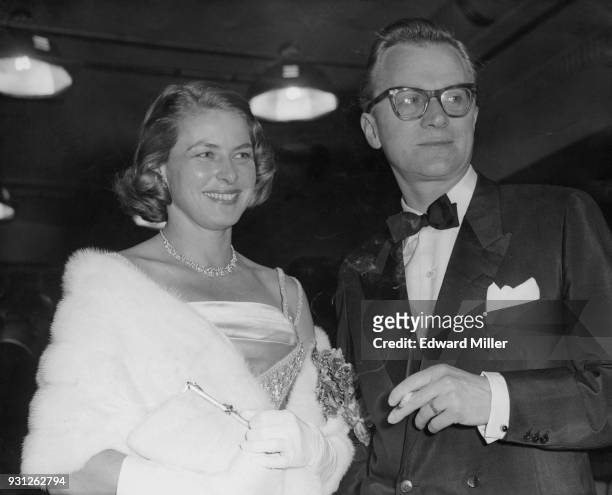 Swedish actress Ingrid Bergman and her fiancé Lars Schmidt arrive at the Odeon Leicester Square in London for the premiere of her film 'The Inn of...