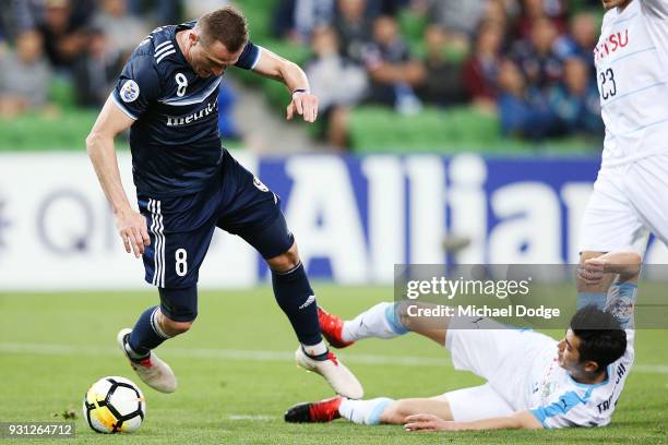 Besart Berisha of the Victory fails to get a free kick from this tackle by Shogo Taniguchi of Kawasaki Frontale in the square during the AFC Asian...