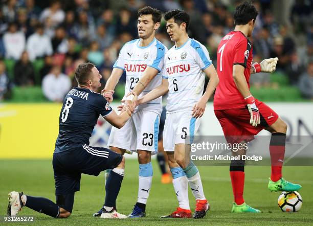 Besart Berisha of the Victory is picked up by Eduardo and Shogo Taniguchi of Kawasaki Frontale in the square during the AFC Asian Champions League...