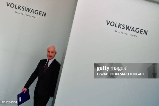 Matthias Mueller, CEO of German car maker Volkswagen , arrives for his company's annual press conference in Berlin on March 13, 2018. Volkswagen...