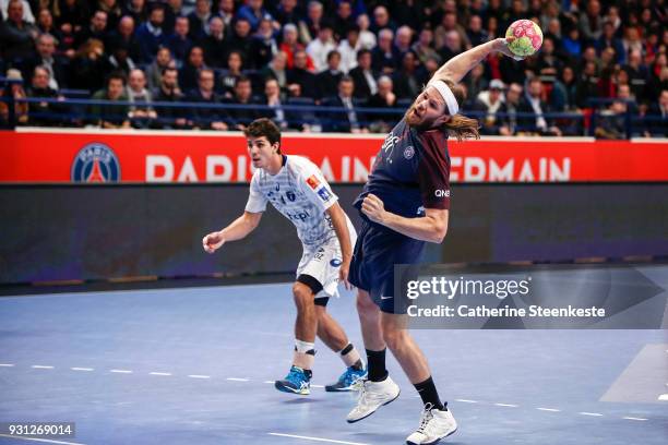 Mikkel Hansen of Paris Saint Germain Handball is shooting a penalty during the Lidl Starligue match between Paris Saint Germain Handball and...
