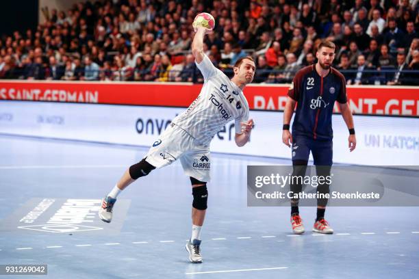 Michael Guigou of Montpellier Handball is shooting a penalty during the Lidl Starligue match between Paris Saint Germain Handball and Montpellier...