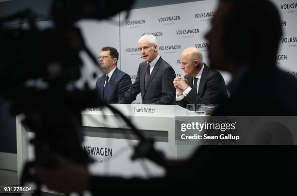 Matthias Mueller , Chairman of German automaker Volkswagen AG, VW Chief Financial Officer Frank Witter and Communications Director Hans-Gerde Bode...