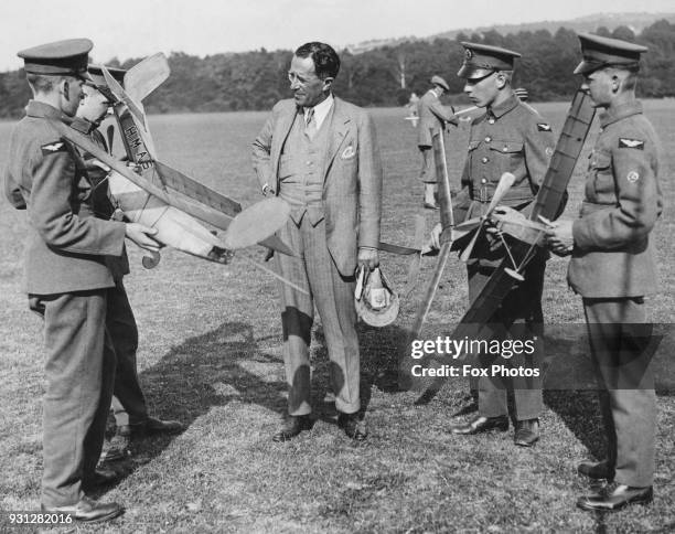 British military aviation pioneer Sir Sefton Brancker of the Royal Flying Corps and RAF, meets model aeroplane builders of four nations at a series...