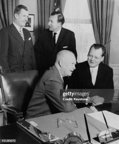 From left to right Livingston T. Merchant, Assistant Secretary of State for European Affairs, Wilhelm Grewe, the German Ambassador to Washington, US...