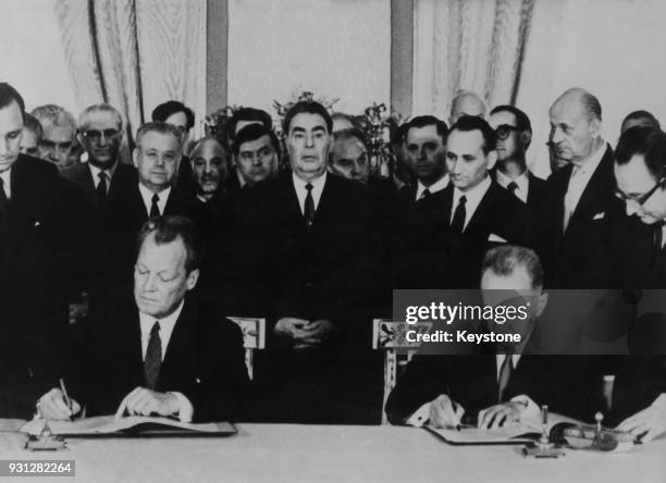 West German Chancellor Willy Brandt and Soviet leader Alexei Kosygin sign a German-Soviet Non-Aggression Treaty at the Kremlin in Moscow, Russia,...