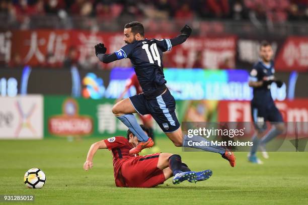 Alex Brosque of Sydney FC takes on the defence during the AFC Champions League Group H match between Kashima Antlers and Sydney FC at Kashima Soccer...