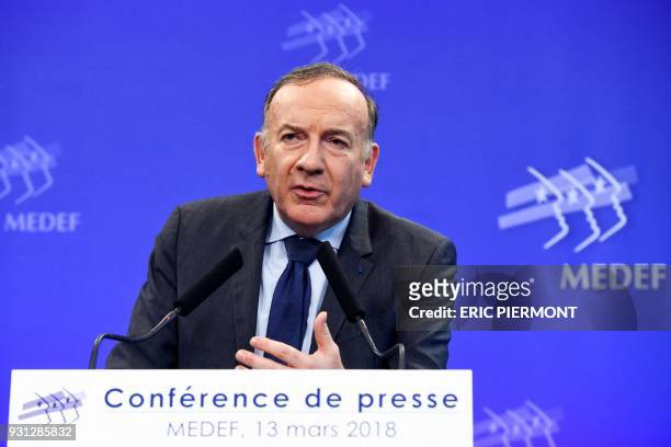 Head of the French employers' federation Medef, Pierre Gattaz speaks during a monthly press conference at the Medef headquarters in Paris on March...