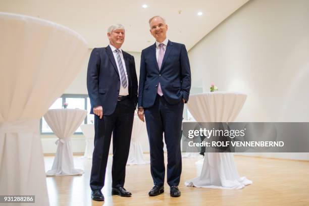 Rolf Martin Schmitz , chairman of German energy supplier RWE, and Johannes Teyssen, CEO of German utility company EON, pose prior to a joint press...